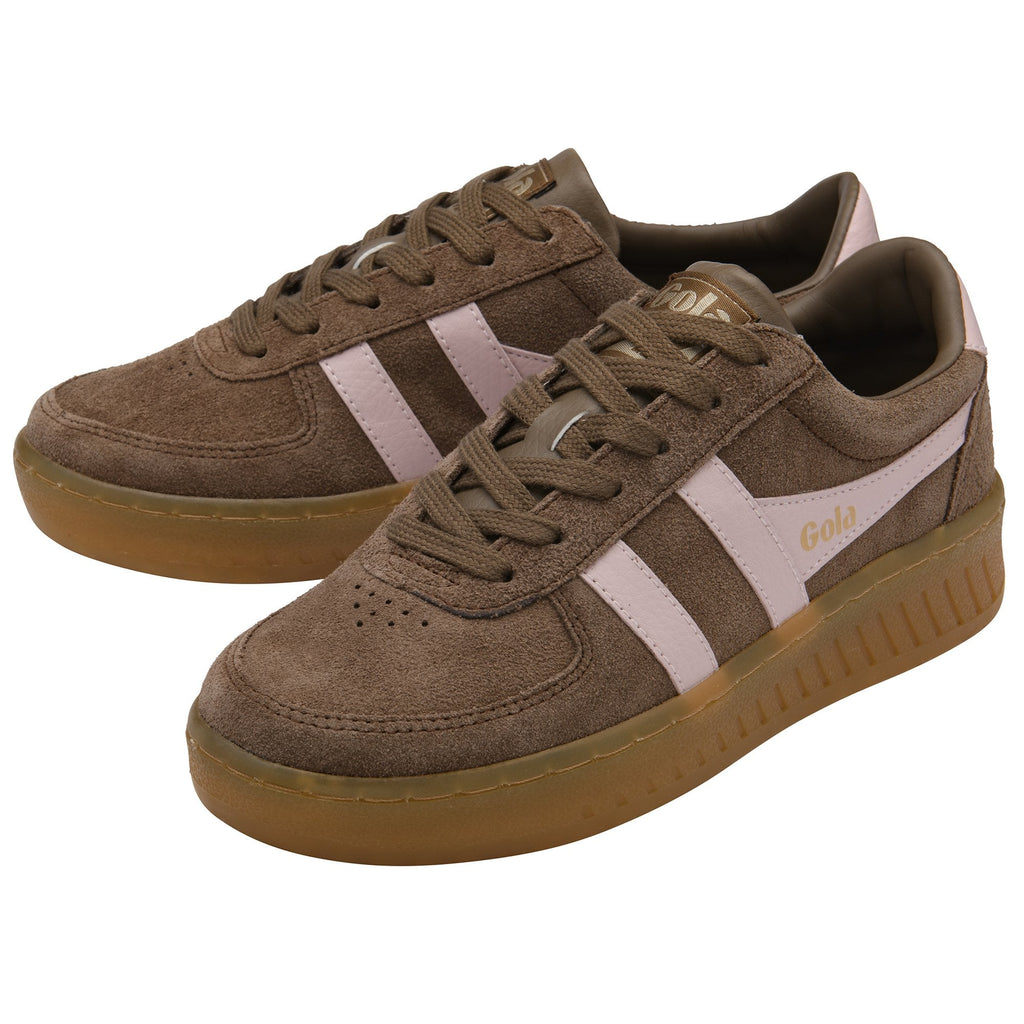 Pair of brown suede sneakers with light pink stripes and gum soles.