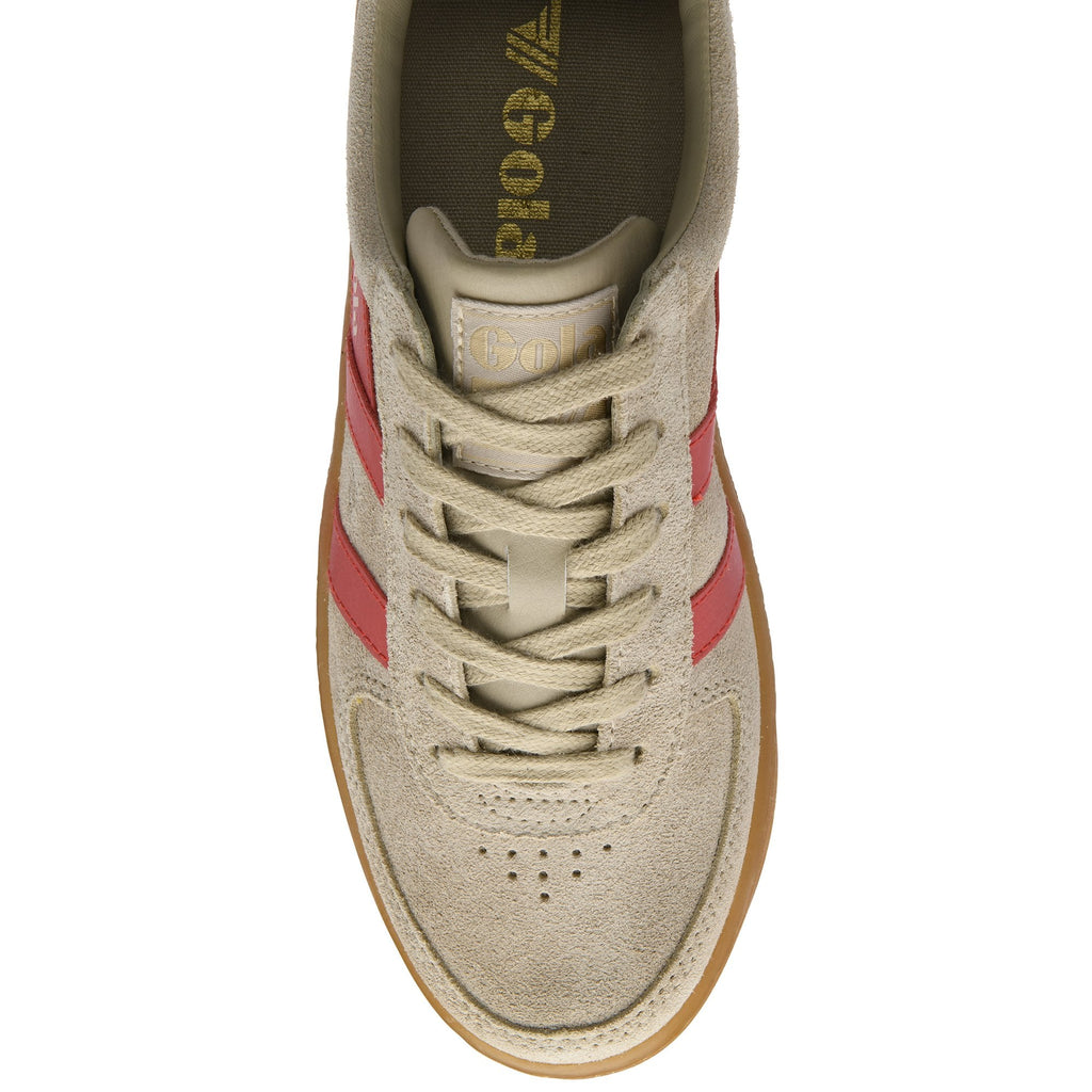 Top-down view of a beige suede sneaker with red stripes and laces.