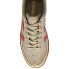 Top-down view of a beige suede sneaker with red stripes and laces.