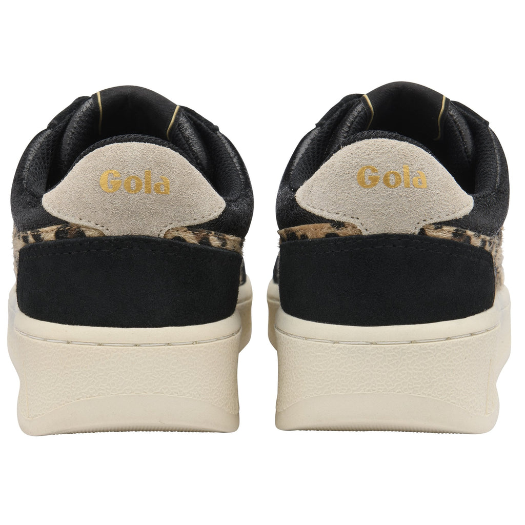 Rear view of two black and leopard print Gola sneakers with cream soles.