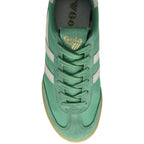 Top-down view of a green Gola sneaker with white stripes and laces.