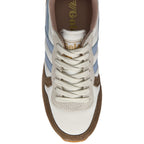 Top-down view of a Gola women's sneaker with white laces, blue stripes, and brown trim.