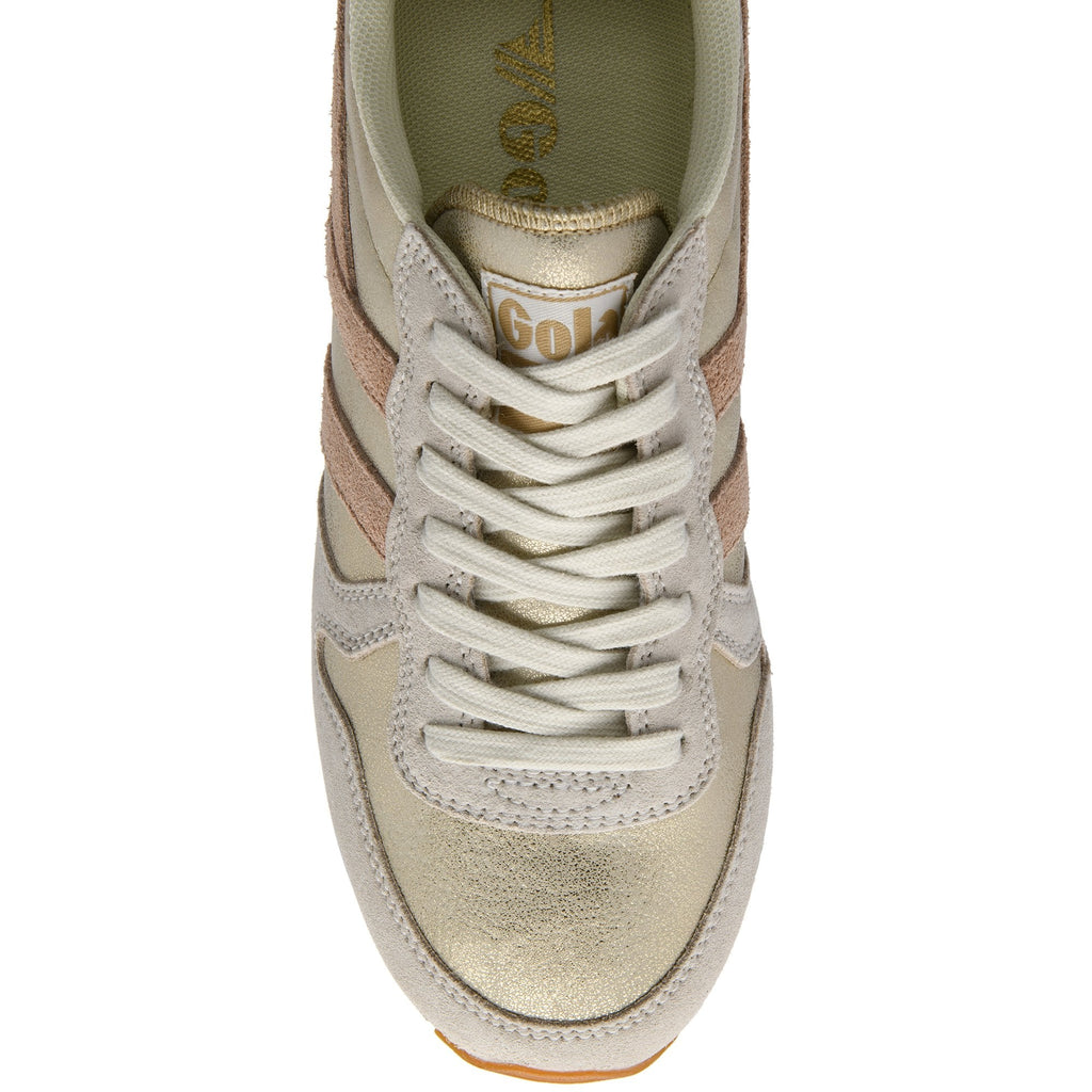Top-down view of a gold and cream Gola sneaker with peach stripes and cream laces.