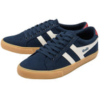 Navy blue trainers with white stripes and tan soles on a white background