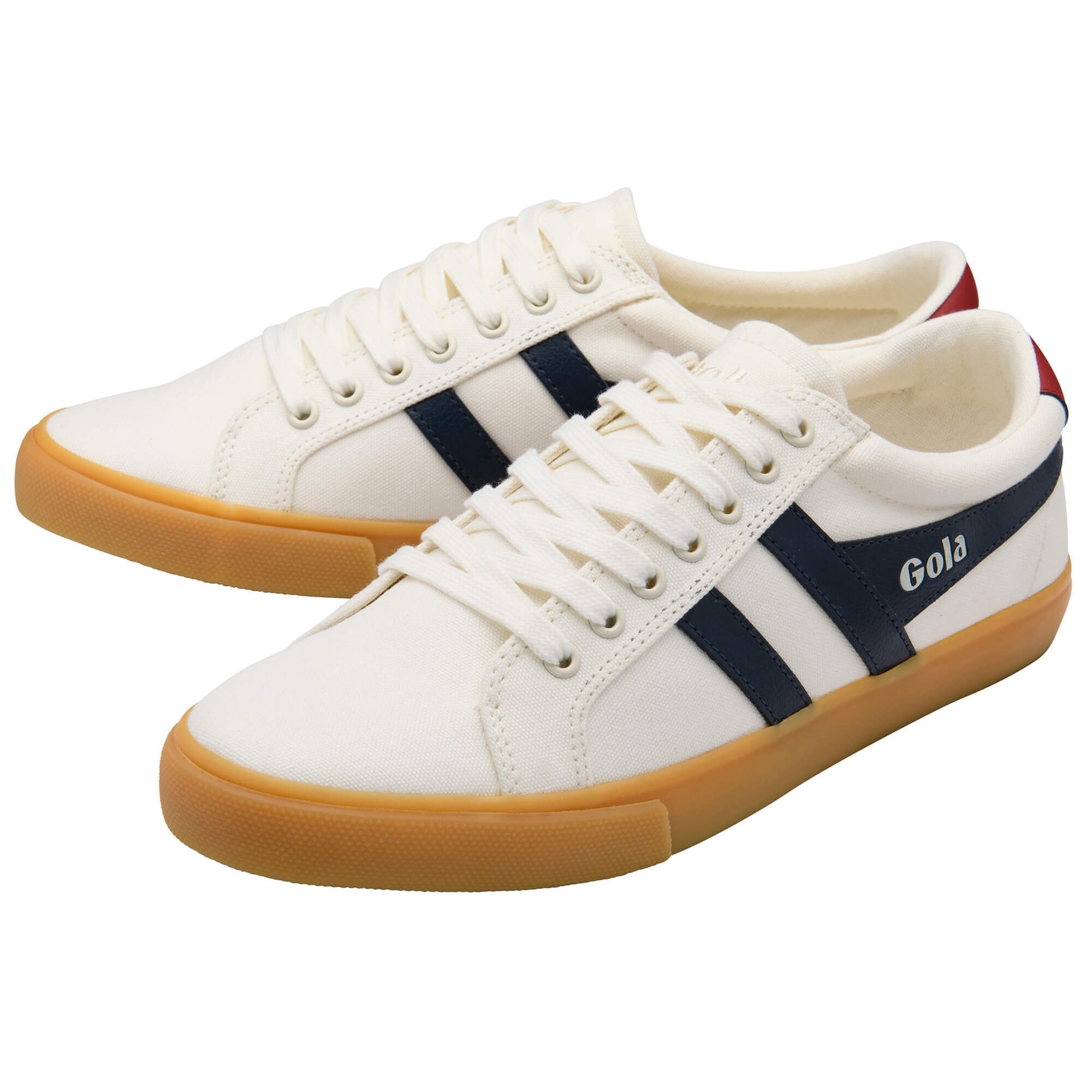 White trainers with navy stripes and brown soles on a white background