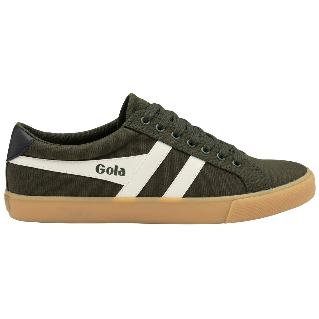 Green trainer with white stripes and brown sole on a white background