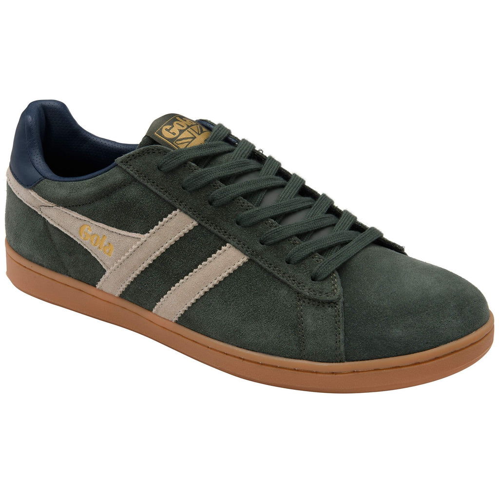 Green suede trainer with brown sole on a white background