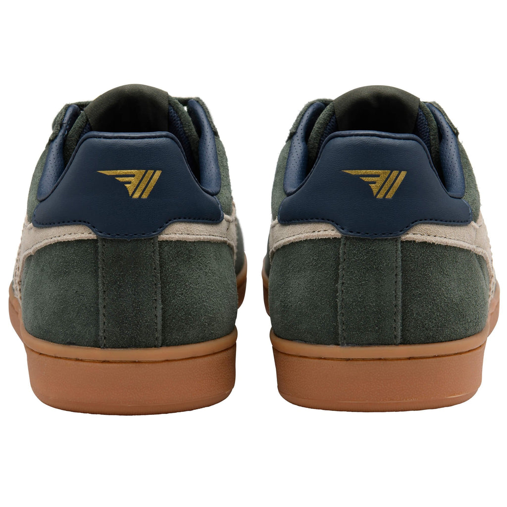 Green trainers with a gold logo on a white background