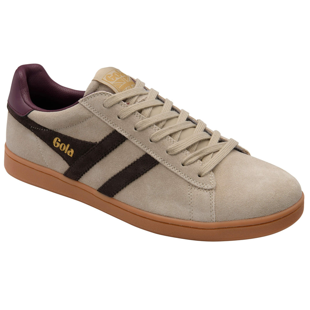 Beige trainer with brown sole and purple accents on a white background