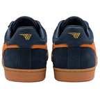 Navy blue trainers with orange accents and a brown sole on a white background