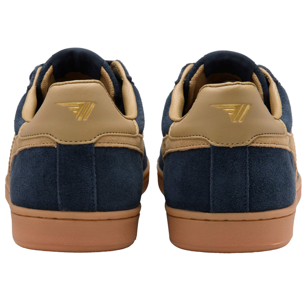 Pair of navy blue suede sneakers with tan leather accents and gum soles, rear view