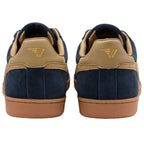 Pair of navy blue suede sneakers with tan leather accents and gum soles, rear view