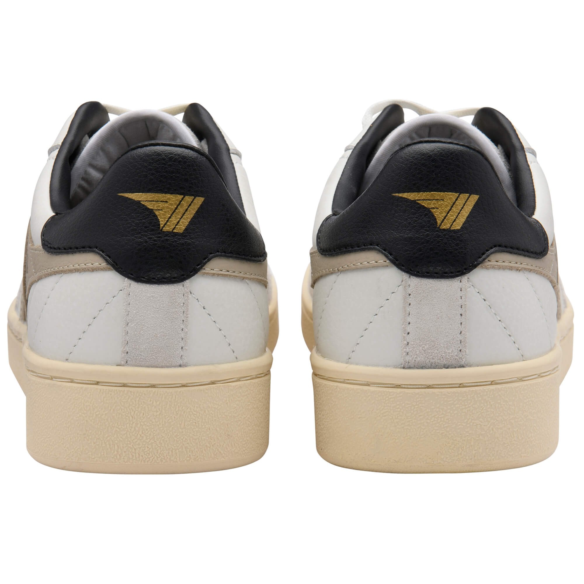 White trainers with black and gold accents on a white background