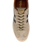 Beige trainer with navy stripes on a white background