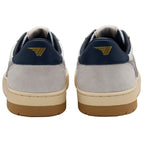 Rear view of two grey and white trainers with navy blue heel tabs and a gold logo