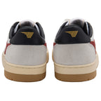 Rear view of two white, red, and black trainers with a gold logo on the heel