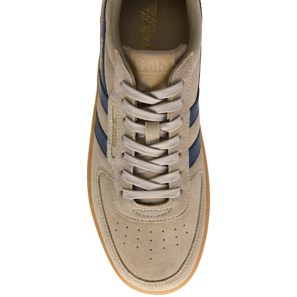 Beige trainer with blue stripes on a white background