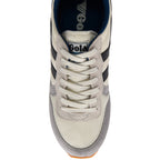 Grey and white trainer with 'Gola' branding on a white background