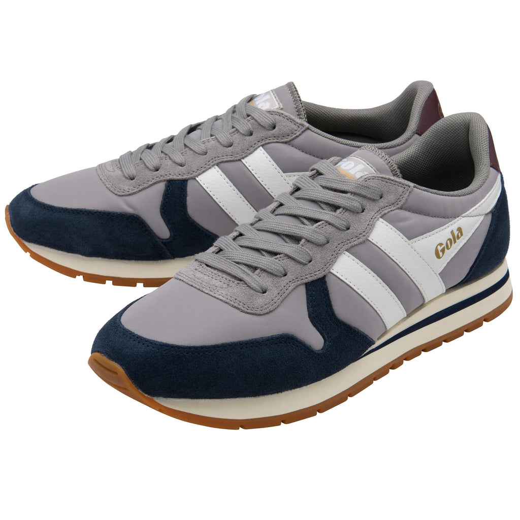 Grey and navy trainers with white stripes on a white background