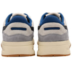Pair of trainers with grey and blue colour scheme on a white background