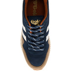 Navy blue trainer with white stripes and tan sole on a white background