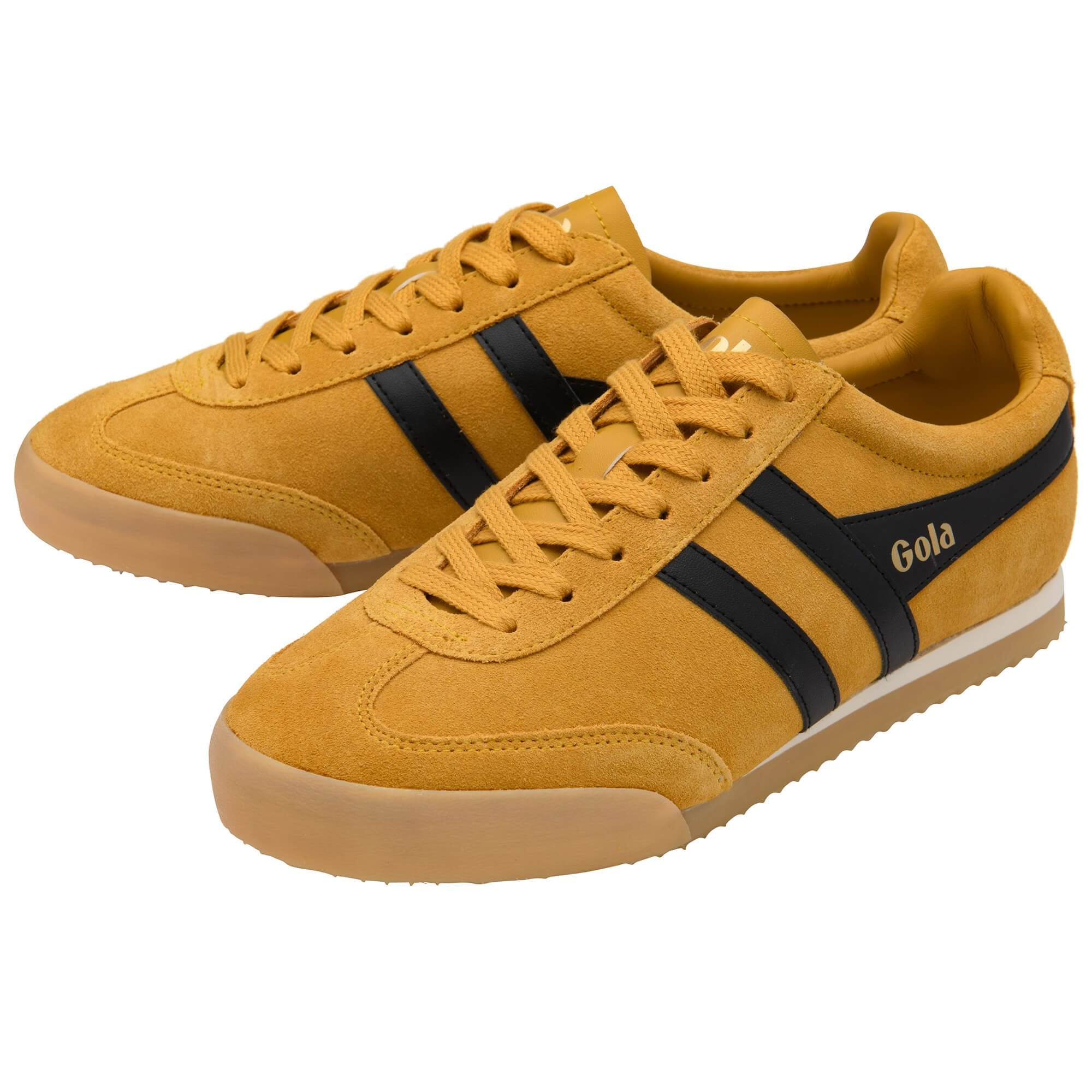Yellow trainers with black stripes and 'Gola' branding on a white background