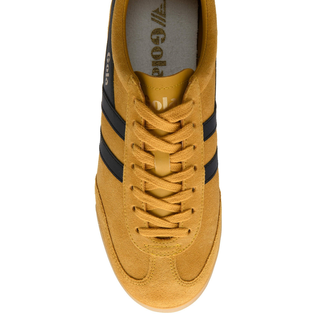 Top-down view of a mustard yellow Gola sneaker with black stripes and laces