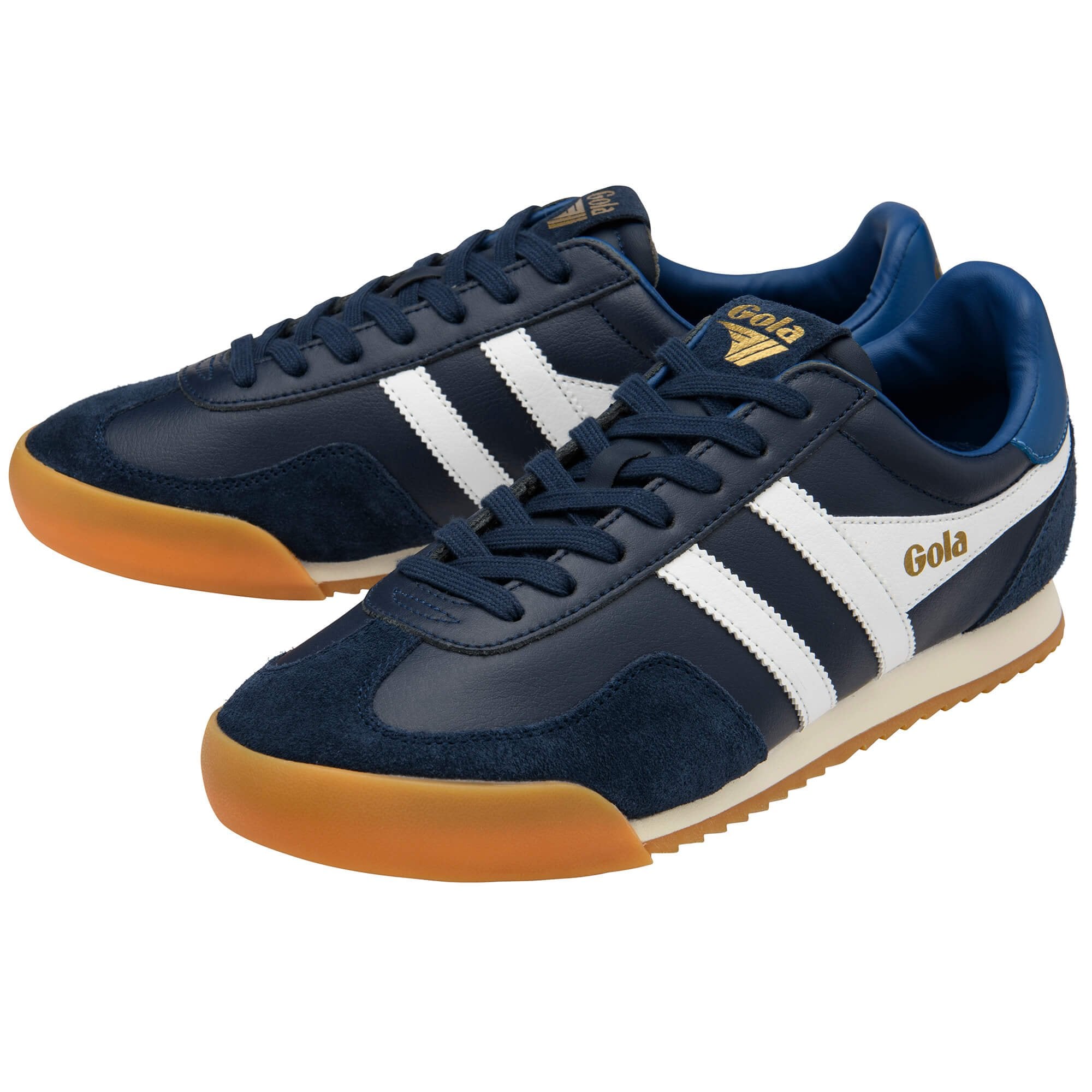 Navy trainers with white stripes on a white background