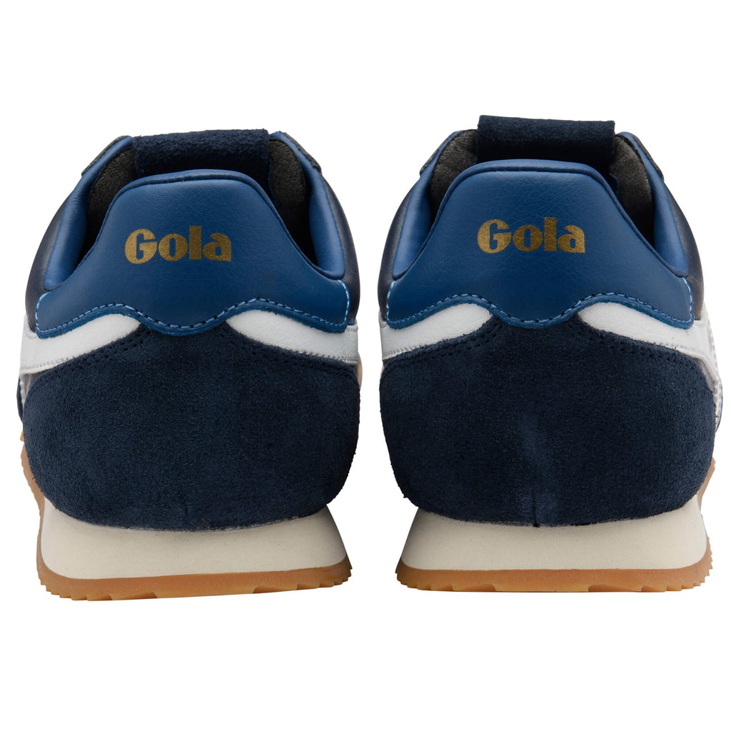 Pair of Gola sneakers, navy blue suede and white leather, with Gola branding in gold on the heel