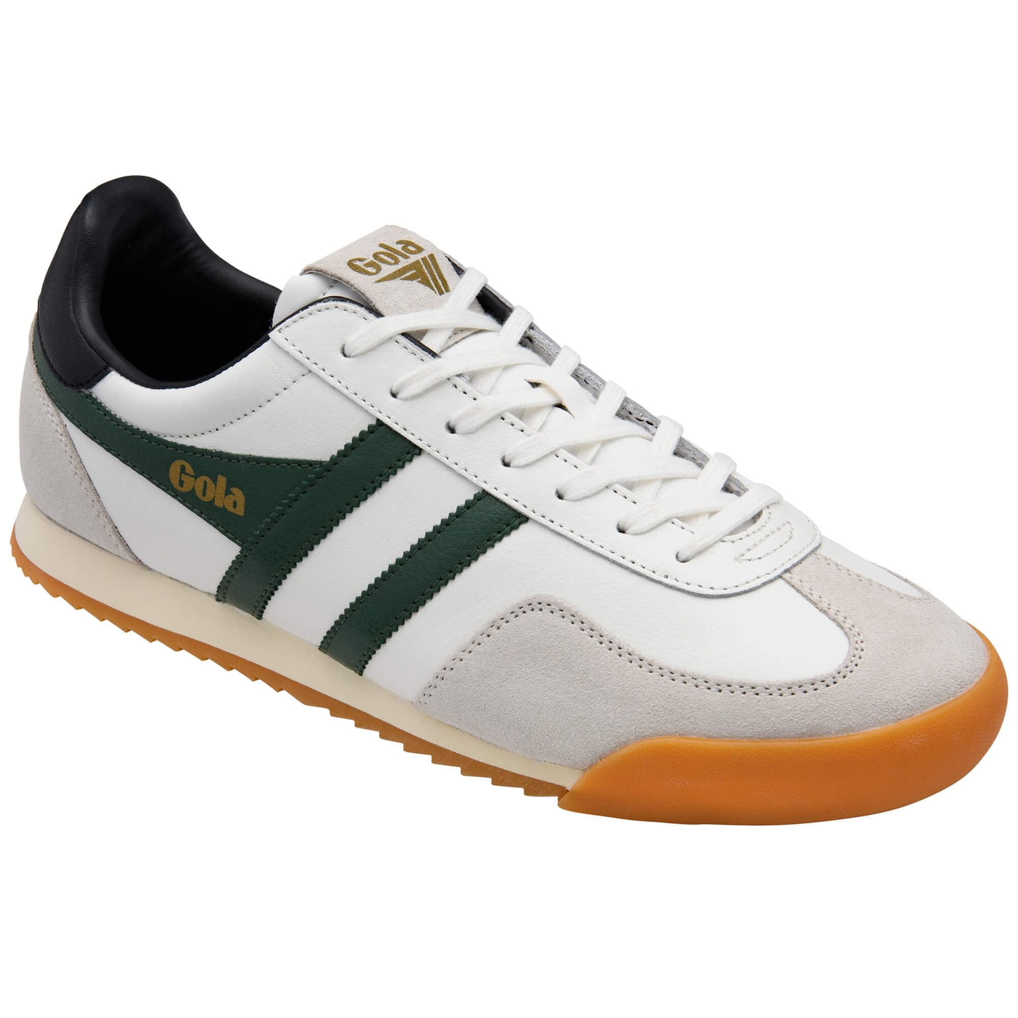 White trainer with green stripes and gum sole on a white background
