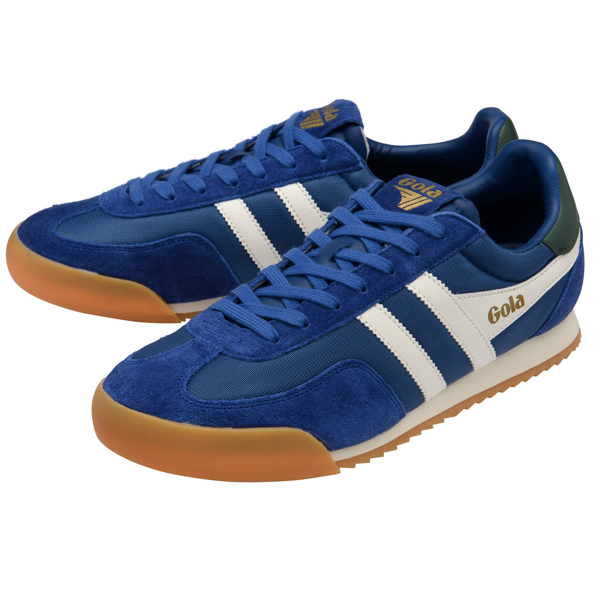 Blue trainers with white stripes and brown soles on a white background
