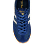 Blue trainer with white stripes and 'Gola' branding on a white background