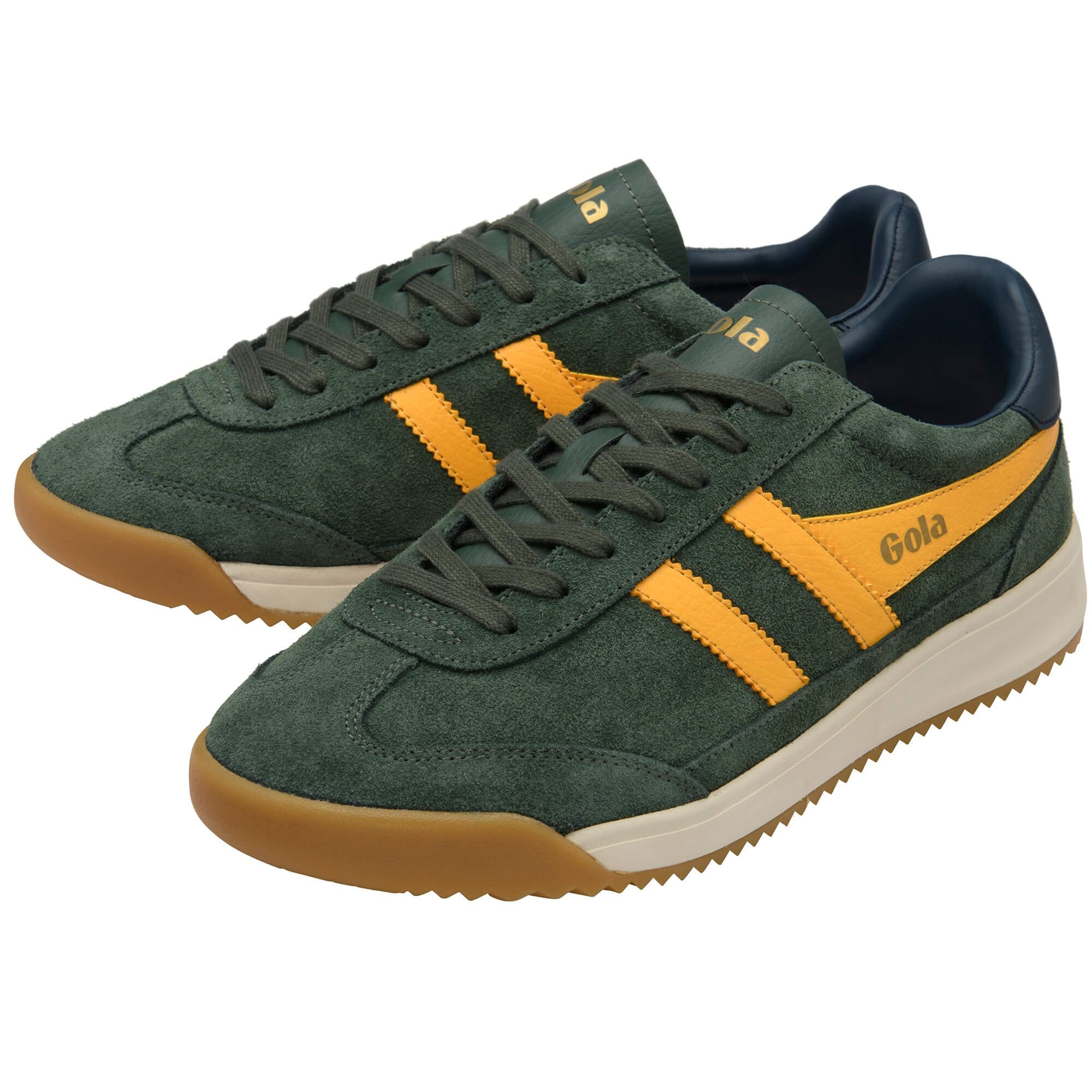 Green and yellow trainers with brown soles on a white background