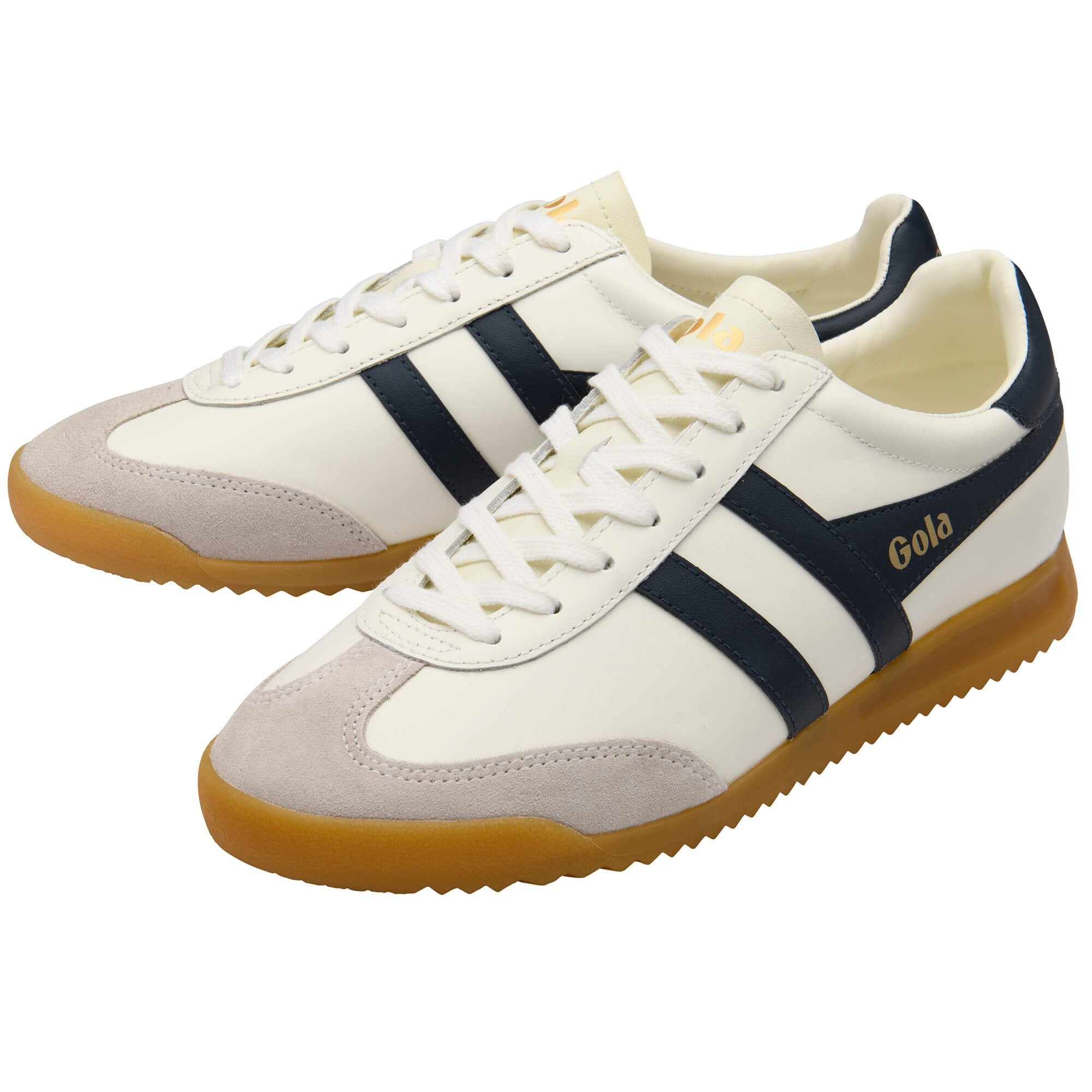 Pair of white trainers with navy stripes and brown soles on a white background
