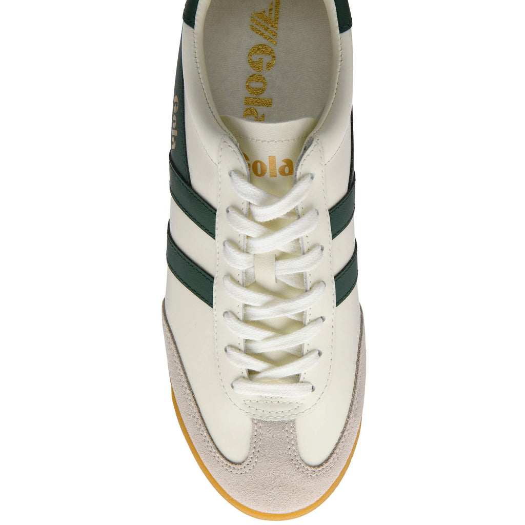 Overhead view of a white Gola sneaker with dark green stripes and laces, and a light brown suede toe.