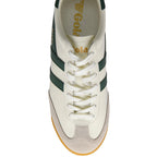 Overhead view of a white Gola sneaker with dark green stripes and laces, and a light brown suede toe.