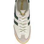 White trainer with green stripes on a white background