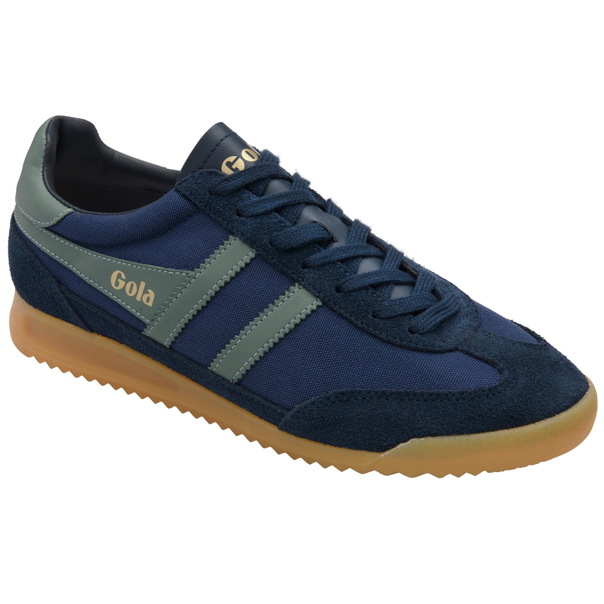 Navy blue trainer with green accents on a white background