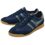 Pair of blue trainers with brown soles on a white background