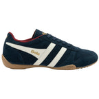 Navy blue Gola trainer with white stripes on a white background