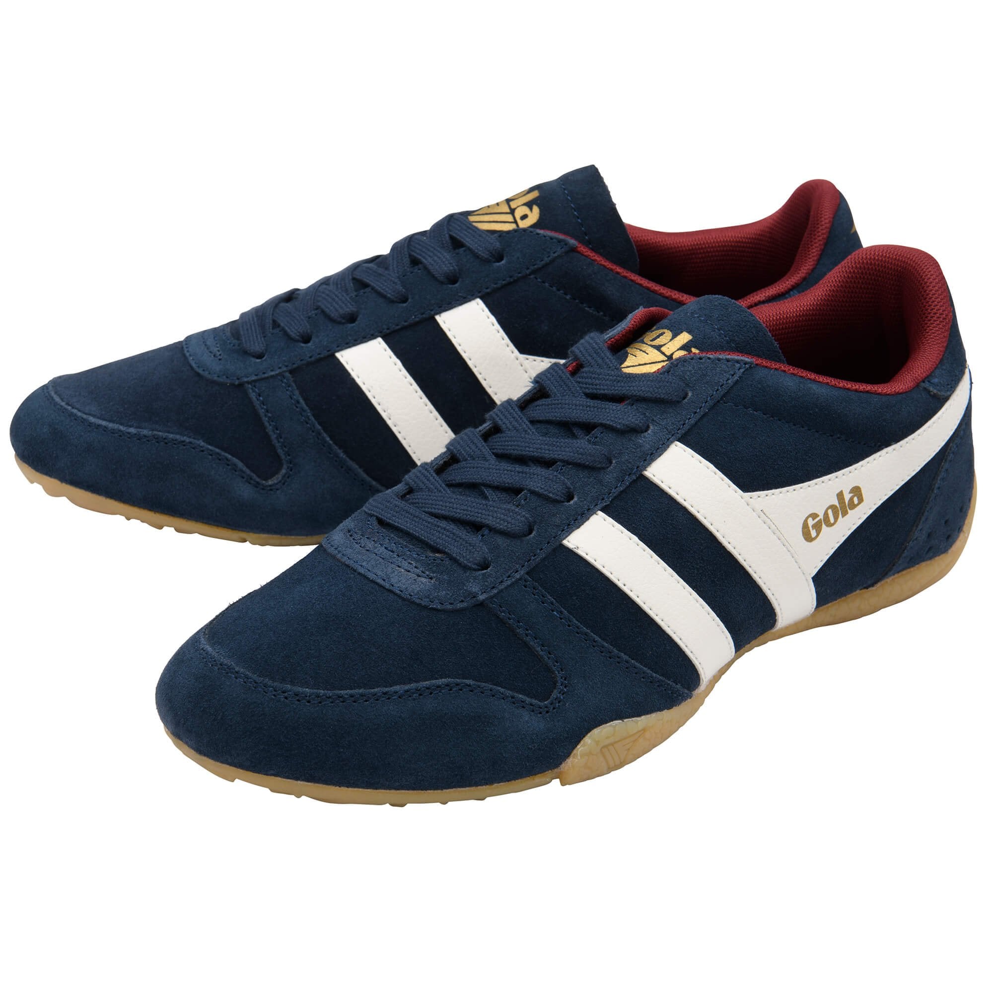 Navy blue trainers with white stripes and red interior on a white background