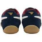 Pair of navy blue trainers with red accents and tan soles on a white background