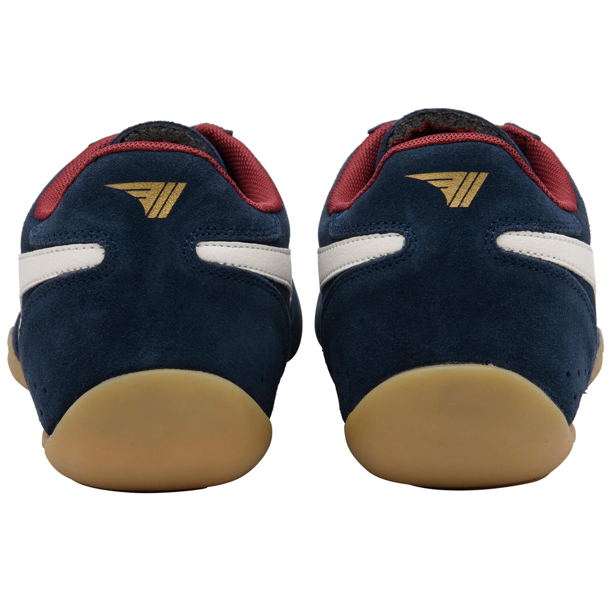Pair of navy blue trainers with red accents and tan soles on a white background