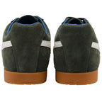 Pair of green suede trainers with brown soles on a white background