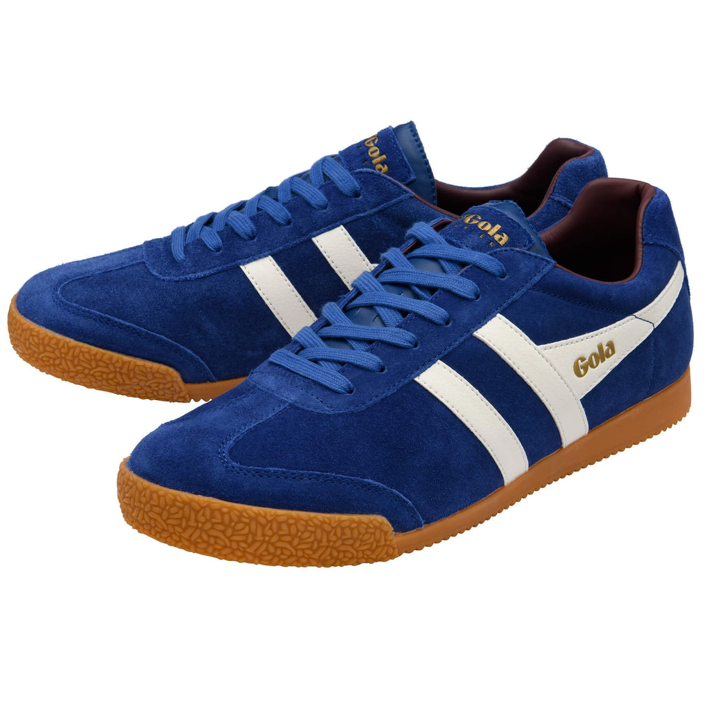 Blue trainers with white stripes and brown soles on a white background