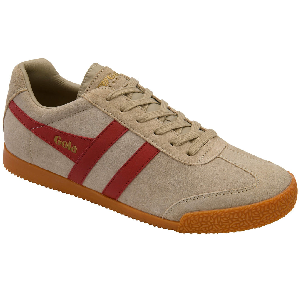 Beige trainer with a red stripe and brown sole on a white background