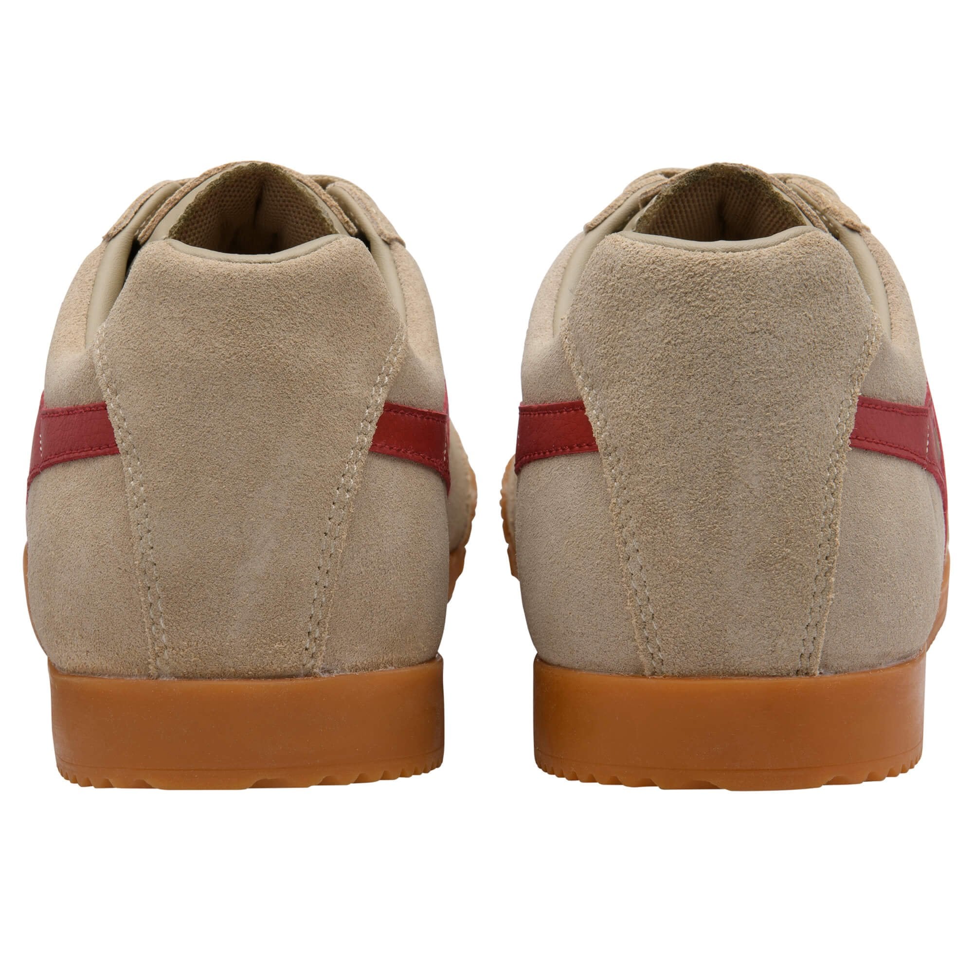 Pair of beige suede trainers with red stripes and brown rubber soles, rear view