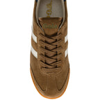Brown trainer with white stripes on a white background