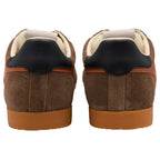 Pair of brown suede trainers with black heel tabs and tan soles, viewed from the back