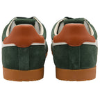 Green trainers with brown soles and heel tabs on a white background